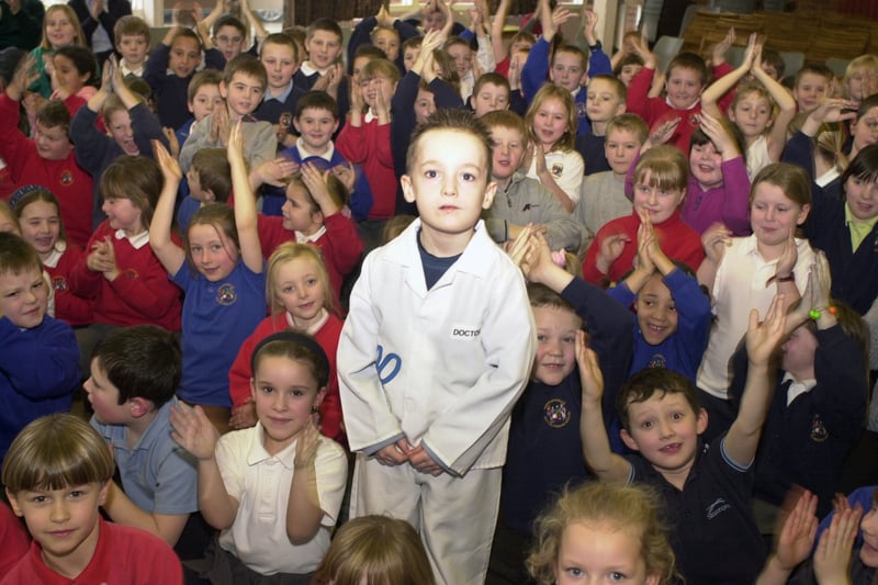 This is cancer sufferer Dale Bowes is applauded by his school friends during his visit to Templenewsam Halton Primary in January 2003.