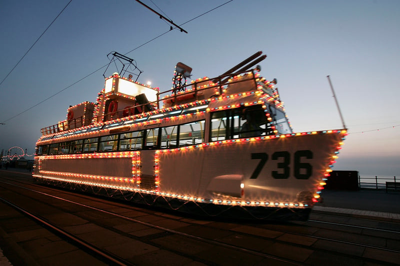 An illuminated tram car is seen on the sea front in 2005