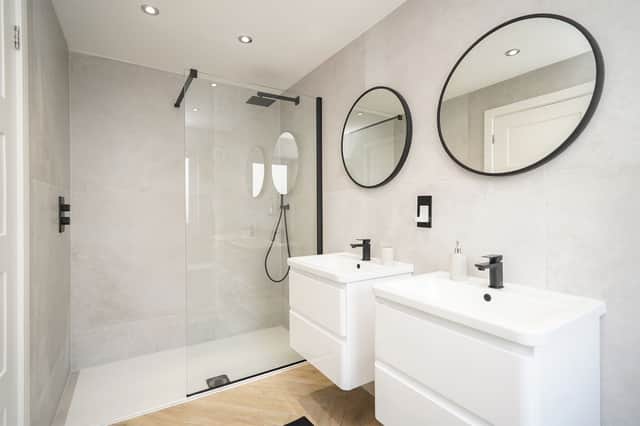 Two sinks, two mirrors, a loo and the tremendous, contemporary, walk-in shower - what an en-suite. (Photo courtesy of Redbrik)