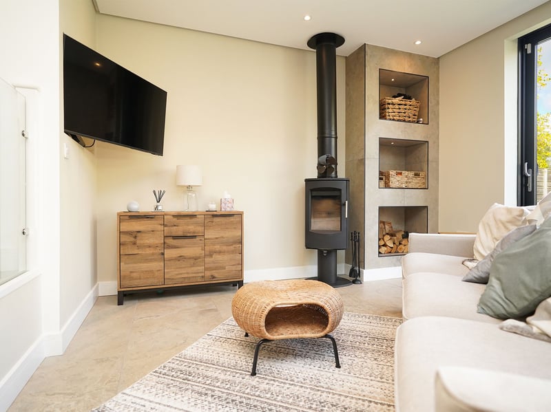 There are two sitting areas in the open plan extension - including this snug. (Photo courtesy of Redbrik)