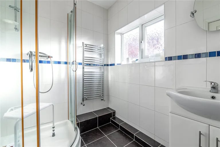 On the first floor is a fully tiled shower room with spacious cubicle as well as a separate WC.