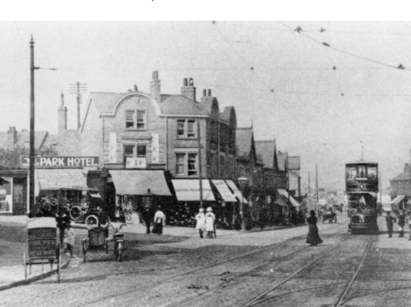 Middlewood Road and the junction with Wadsley Lane pictured in 1913, showing The Park Hotel sign, Thomas Hetherington butchers shop, Ernest Hawley newsagents, Greenlees and Sons boot dealers, and A. Harwood Lingard ironmongers