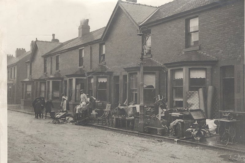 This picture underlines the heartbreak which the 1927 floods caused in Fleetwood as householders pile their sodden belongings on the pavement