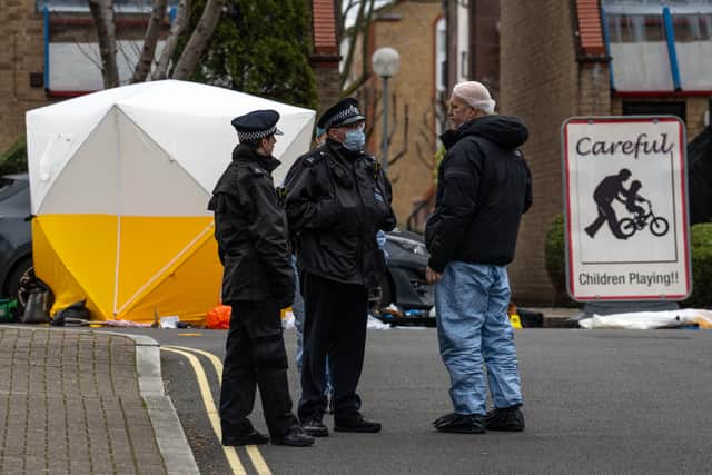 Police and forensics officers work at the scene of a shooting on January 30, 2024 in Southwark. (Photo by Carl Court/Getty Images)