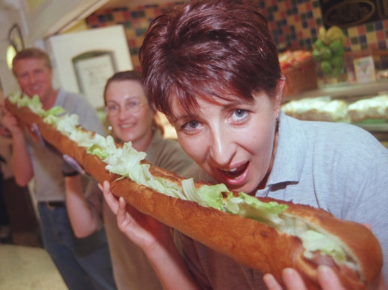 Deli Shuss (delicious), on the corner of Church Street and Orchard Street, is a popular city centre sandwich shop. Pictured there in 1999 are Janette French, Susan Henser and Vaughn Steel tucking into a six-foot-long baguette.