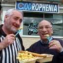 Codrophenia on Walkley Bank Road, Sheffield, with owner Iain Pringle (left) and Cyril Solomons (right) outside, in 2007. Inspired by the classic 1979 film, complete with a Mod-themed sign and a scooter-riding fish.