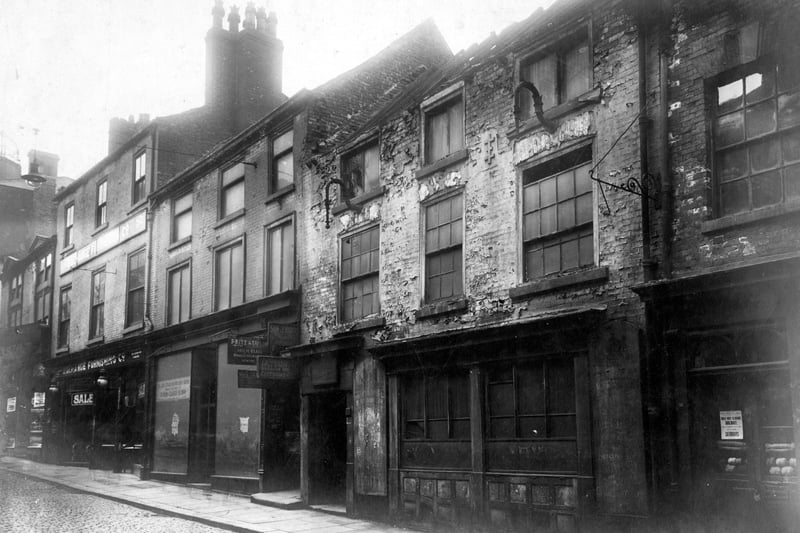 Lower Headrow in September 1928 Looking at north west side, vacant properties. In the centre, entrance to Atkinsons Court and Kings Arms Yard. This was prior to demolition for improvement.