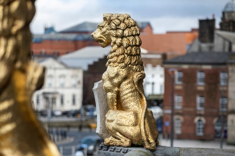 A refurbished golden lion on the balcony. 