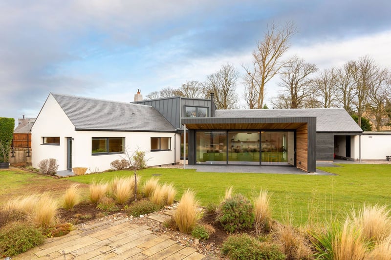 A chic architect-designed property that’s set in an exclusive North Berwick development, and is currently for sale at offers over £1.2 million, this lavish home at Eelburn House, 11, Westerdunes Park, North Berwick, is moments from the golf course, the beach, and the High Street. Eelburn House is immaculate inside and out, while a recent renovation means it’s incredibly energy efficient. It offers five double bedrooms, four en-suite bathrooms, two large family sitting rooms with wood burning stoves, and an ample designer kitchen fitted with high-end appliances. Outside is just as impressive, where the generous garden boasts
an outdoor shower, hot tub and summer house.