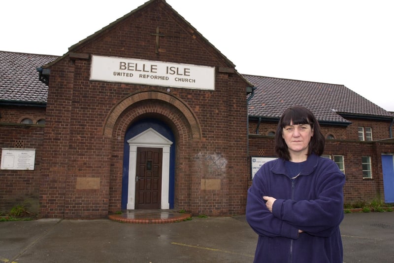 Church treasurer Pat Rowe outside Belle Isle United Reform Church on Nesfield Road where many of the windows have been smashed by vandals. Pictured in April 2001.