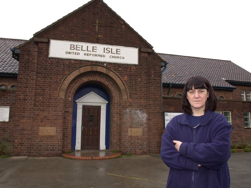 Church treasurer Pat Rowe outside Belle Isle United Reform Church on Nesfield Road where many of the windows have been smashed by vandals. Pictured in April 2001.