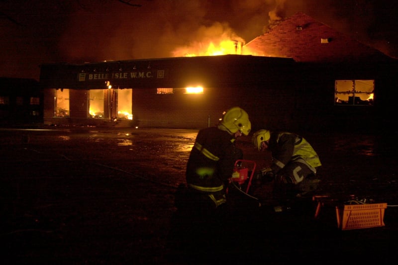 Firefighters deal with a blaze which gutted Belle Isle Working Mens Club in December 2000.
