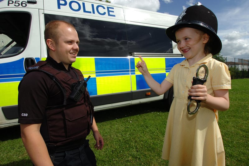 Washington Community Support Officer Richard Howey gets a ticking off from five-year old Ruby Pallister at the school summer fair in 2010.