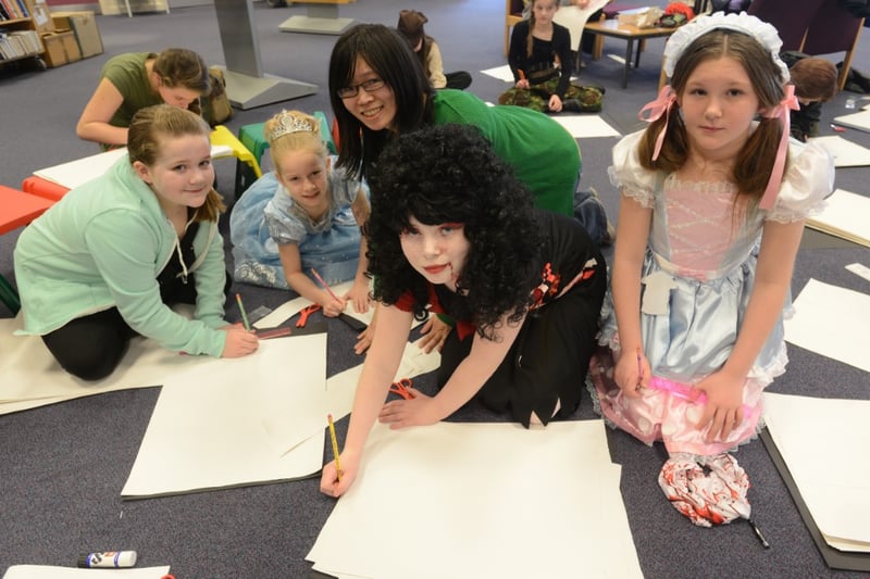 Artist Pui Lee worked with children from St Cuthbert's School as part of World Book Day, at Sandhill Centre Library in 2014.