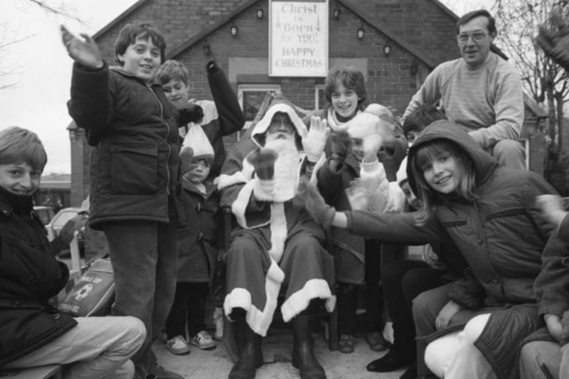 Santa Claus is pictured with happy children at Cleadon Methodist Church in December 1985. 