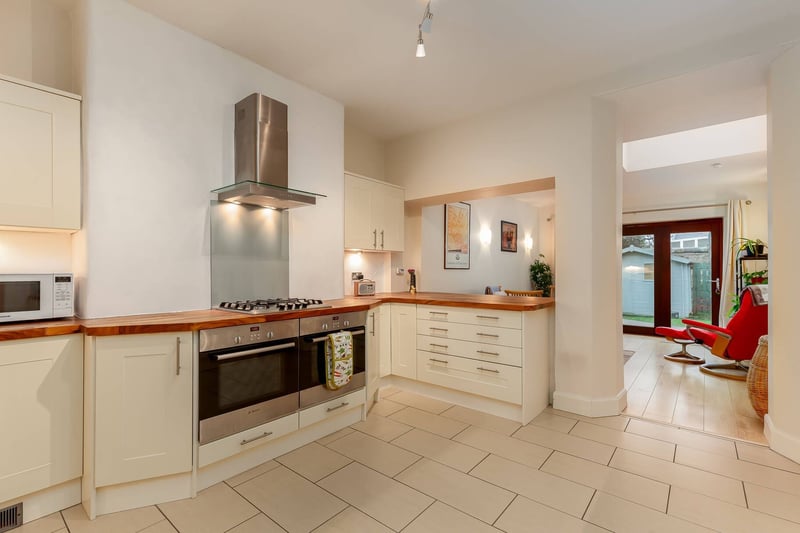 The spacious extended kitchen with integrated appliances and larder storage cupboards.