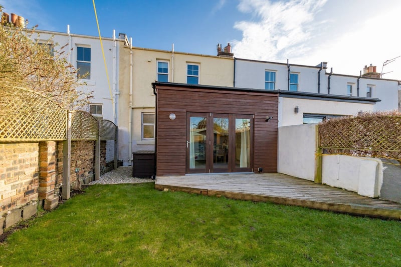 The enclosed garden at the rear with decking and garden shed. With shared rear garden lane access to main road. There is also a front garden as well as unrestricted on-street parking.