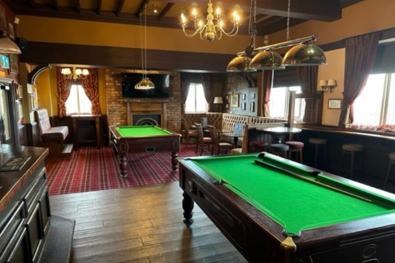 The games room features two pool tables, a darts throw area and seating for around 40 to 50 people.