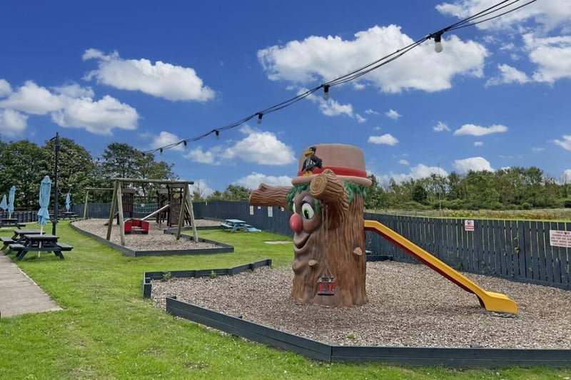 The venue is family-friendly, with a children's play area outside on the site.