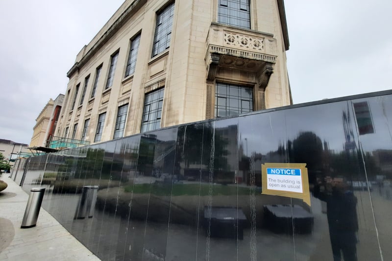 The crumbling, listed Central Library needs millions to fix the council doesn't have. Meanwhile a black hoarding stops bits falling on to people.