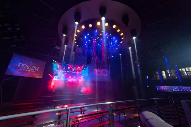 Lights flood the dancefloor