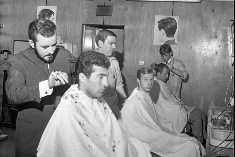 The Russian football team having hair cuts at Durham City hairdresser Jack Brown in 1966.
