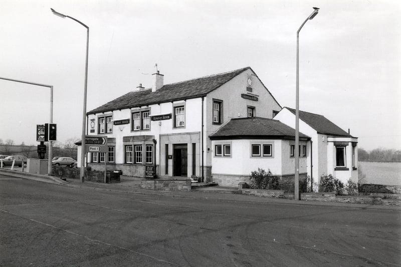 The Dyneley Arms pub at the junction of Leeds Road and Pool Bank New Road. A pub has stood here since at least the mid 19th century but the original Dyneley Arms was replaced by this one at some point. The pub as seen here  closed down in October 2002 after suffering severe damage in a fire