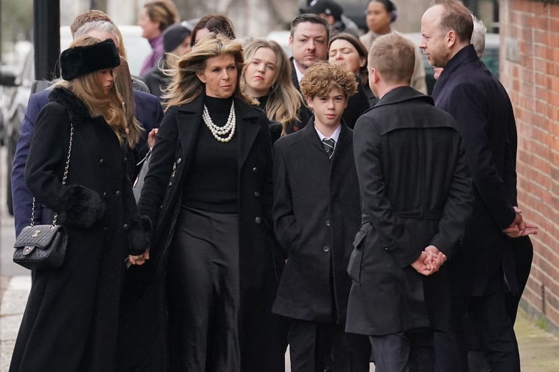 Kate Garraway arrives for the funeral service with her and Derek's two children. 