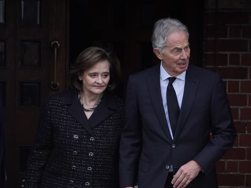 Former prime minister Tony Blair and his wife Cherie Blair leaving the funeral service of Derek Draper 