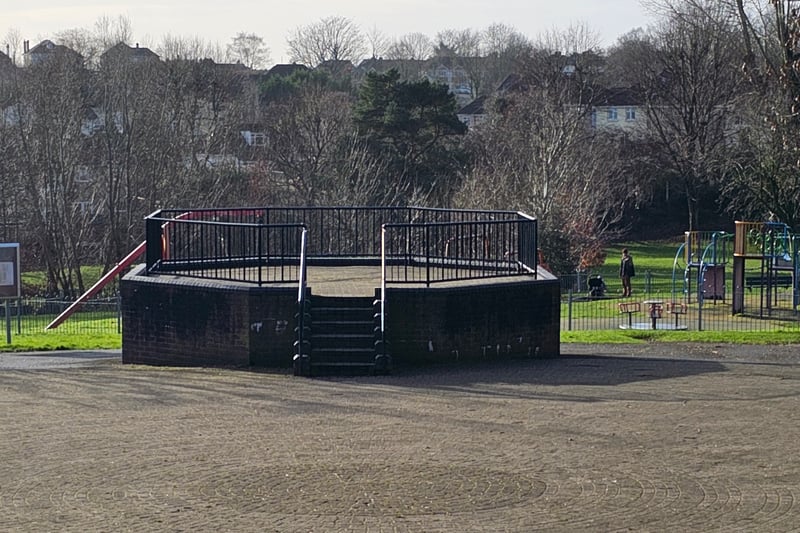 The bandstand is located in the middle of the park.
