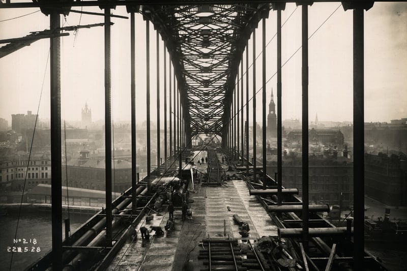 View along the Tyne Bridge towards Newcastle, as work continues on its roadway, 22 May 1928