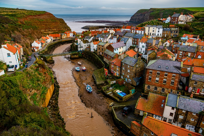 Staithes, an old fishing village bursting with charm in North Yorkshire, is celebrated for its huddled cottages, winding streets and towering cliffs. It would make a unique getaway from Leeds for a weekend, as it's just an hour and 40 minutes away by car.