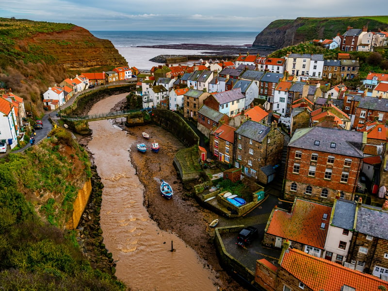 Staithes, an old fishing village bursting with charm in North Yorkshire, is celebrated for its huddled cottages, winding streets and towering cliffs. It would make a unique getaway from Leeds for a weekend, as it's just an hour and 40 minutes away by car.