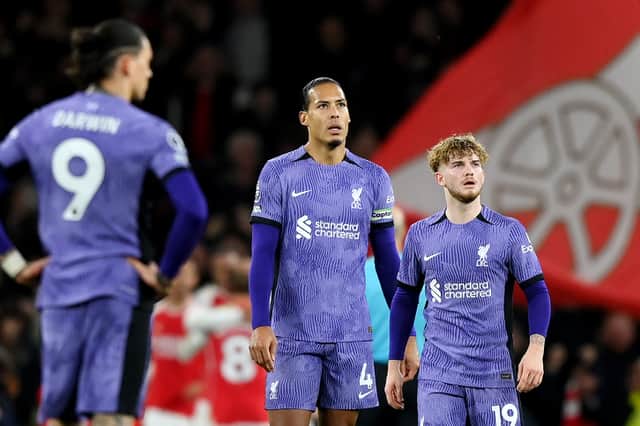 Virgil van Dijk and Harvey Elliott of Liverpool look dejected after Leandro Trossard of Arsenal (not pictured) scores his team's third goal during the Premier League match between Arsenal FC and Liverpool FC at Emirates Stadium on February 04, 2024 in London, England. (Photo by Justin Setterfield/Getty Images)