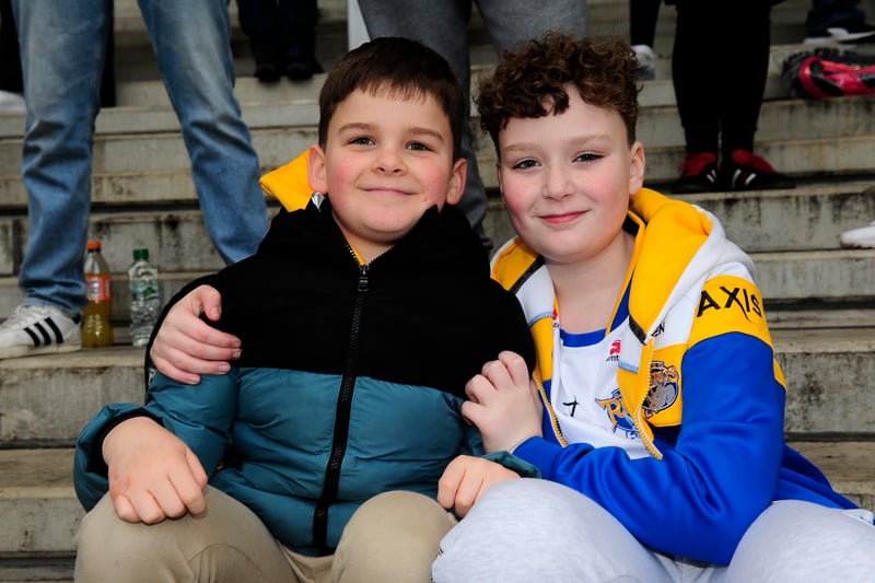 Young fans braved strong winds this afternoon to show their support.