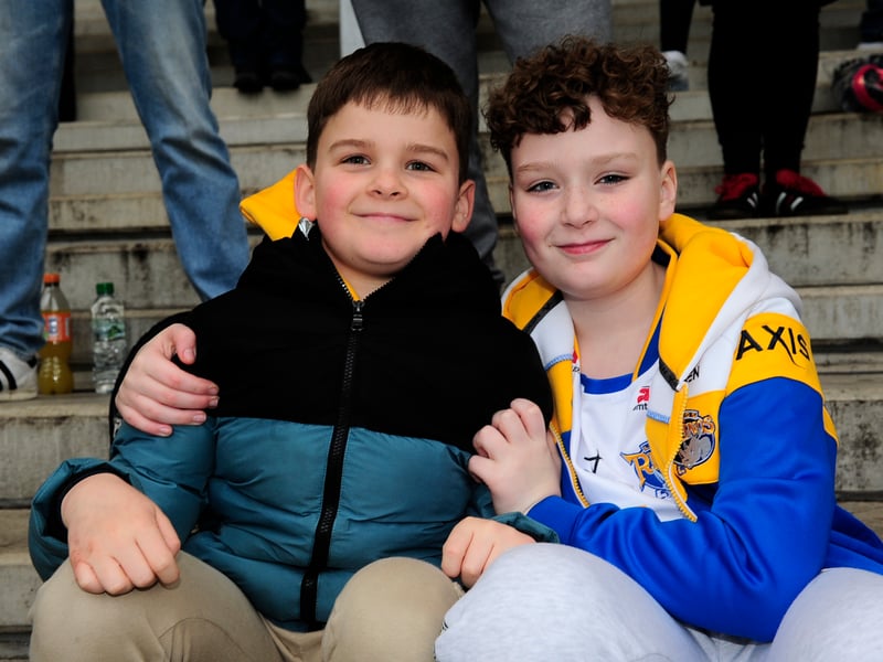 Young fans braved strong winds this afternoon to show their support.