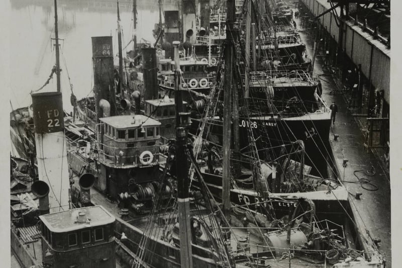 Trawlers of the fishing fleet return from the fishing grounds to the harbour at Fleetwood on the 1st December 1934. 