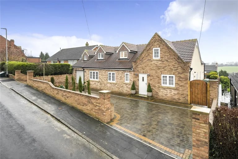 This stunning detached home with south facing gardens and luxurious interiors is on the market.