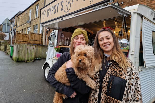 Bianca and Rhiannon Silcock-Randle, with pet dog Gyspsy, on their last day with the Gypsy's Brew van. Picture: David Kessen, National World