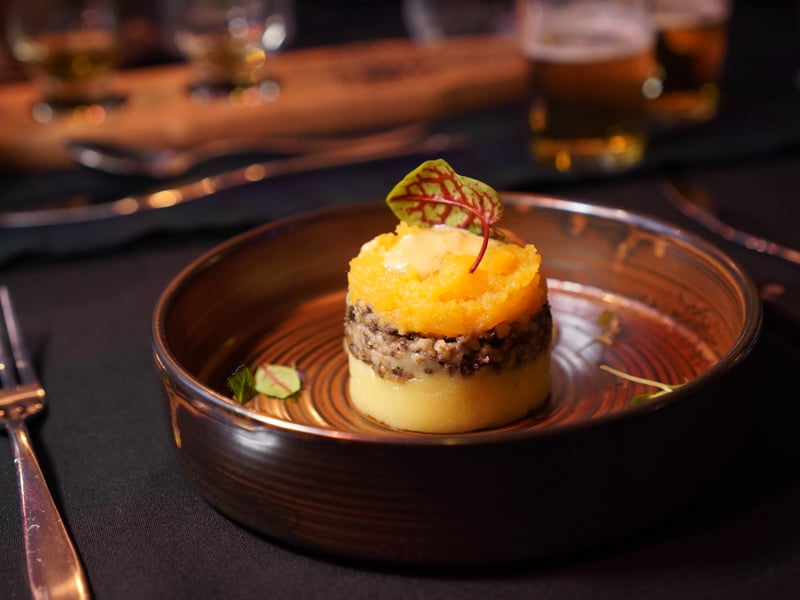 Haggis, Neeps, and Tatties layered and presented beautifully. The ratios are perfect and allow for the all-Scottish taste pairing on the palate.