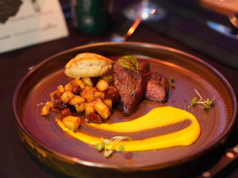 Venison paired with Stornoway black pudding in a pastry shell, alongside chorizo, miniature roast potatoes, and a thick Isle of Mull cheese sauce. Truly encompassing all of Scottish cuisine from across the country.