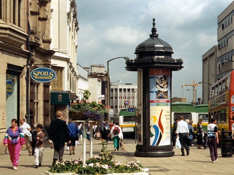 High Street, Sheffield city centre, in July 1991, showing a newly placed advertising stand outside Spoils Kitchen Reject Shop