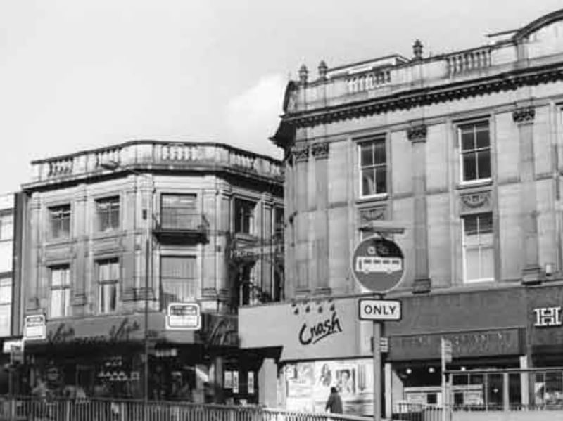 Shops on High Street, Sheffield city centre, in 1986, including H. Samuel jewellers, Leeds Permanent Building Society, Crash Clothes and Virgin Records