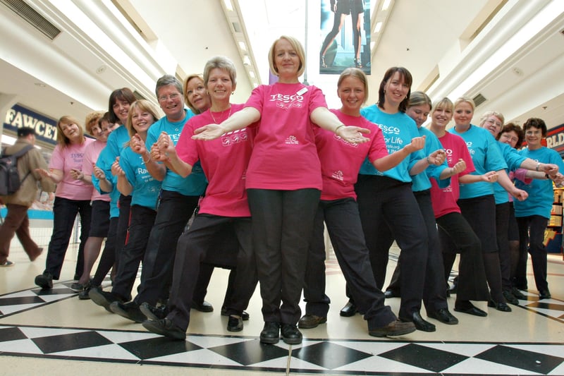 These store workers did a sponsored walk for Cancer Research in 2006.