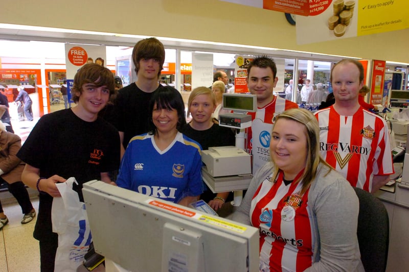 Bridges store staff dressed in football tops in aid of the CLIC Sargent childrens cancer charity on FA Cup Final day in 2010.