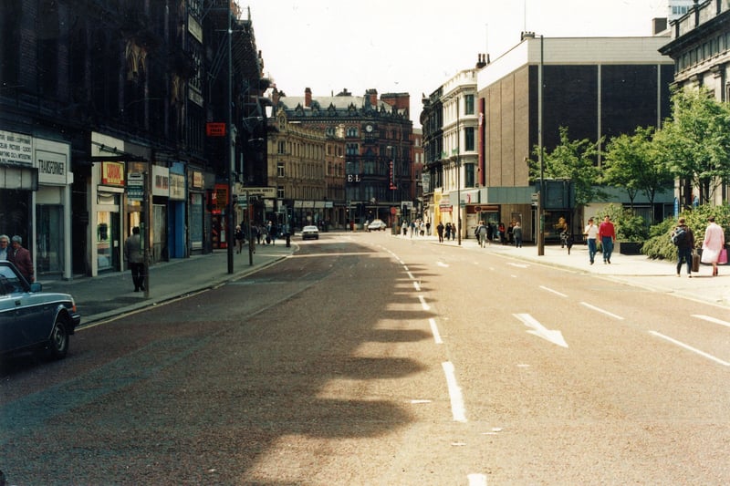 Boar Lane looking west. At the right edge is Holy Trinity Church. The large square building with flat roof is numbers 66 to 69 Boar Lane housing C & A. This building is now demolished and this area was to undergo new development as the Trinity Quarter. 