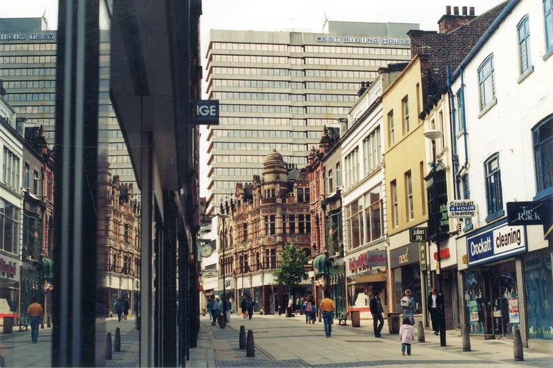 Commercial Street looking west from the direction of Briggate. The tree stands at the junction with Lands Lane. West Riding House dominates the background and is situated in Albion Street.