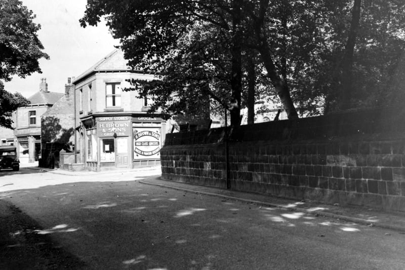 .View looking north west at the corner of Green Road and Church Lane. H. Brown and Sons grocers can be seen. A truck is visible on the left. Pictured in September 1951. 