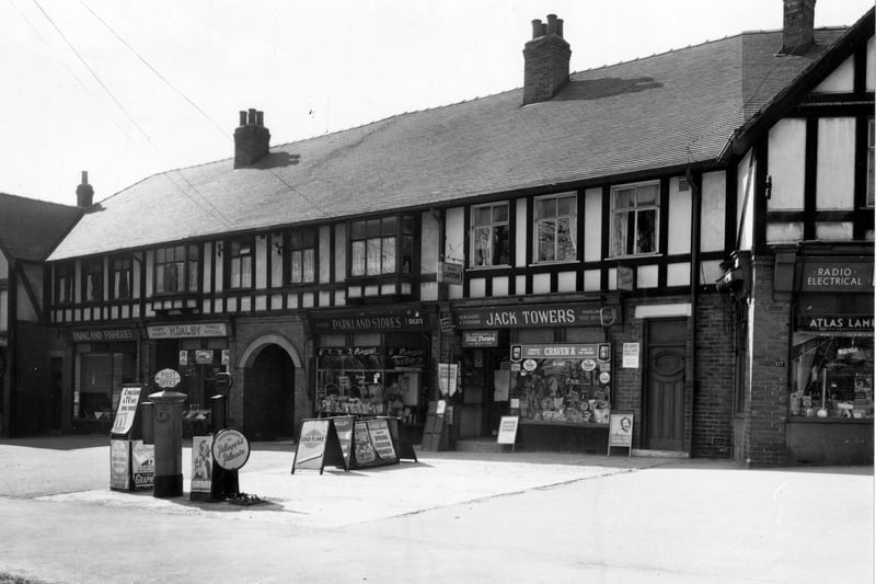 Shops at number 169 to 177 on Stonegate Road in April 1956. Pictured, from left, are Parkland Fisheries; Harry Dalby, family butcher; Parkland Stores, fruit and fish shop; Jack Towers, stationer, and on the corner, Pearson Bros., radio and electrical shop. Advertisements outside are for; Goldflake Tobacco, T.V. Stamps, Woman's Journal, Woman's Own, Player's cigarettes, Lyon's Ice Cream and Orange Maid lollies, among others. 