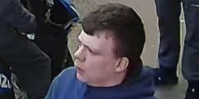 One of the men, who is pictured wearing a navy-blue hooded top, is described as a white man, of a large build, with short cropped brown hair.